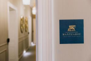 Certifikát, hodnocení, plakát nebo jiný dokument vystavený v ubytování Mantzarou Suites by Corfu Collection