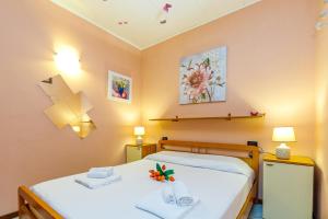 Posteľ alebo postele v izbe v ubytovaní Magnolia Sirmione 500m from lake Garda - Happy Rentals