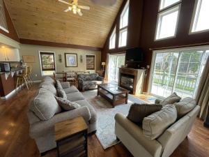 a large living room with couches and a fireplace at Ski Boots N Bathing Suits in McHenry