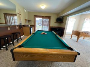 a living room with a pool table in it at Ski Boots N Bathing Suits in McHenry