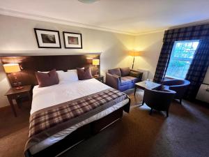 מיטה או מיטות בחדר ב-Old Loans Inn