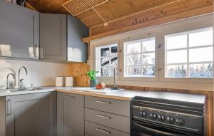 a kitchen with a sink and a stove at 3 Bedroom Amazing Home In Gol in Gol