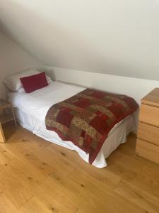 a bedroom with a bed with a blanket on it at Best Beach 2025 "Little Haven" & The Hidden Gem in Haverfordwest +29 photos