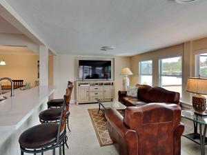 a living room with a couch and a table at Tortuga Too in Fort Myers Beach