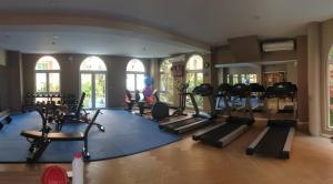 a woman is in a gym with pilates equipment at Seven Seas Pattaya by nty in Jomtien Beach