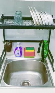 a kitchen sink with a shelf above it at Mesahill Studio 2 Fullbed by DKAY in Nilai in Nilai