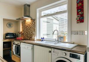 a kitchen with a sink and a window at Kenmore House, Elie in Elie