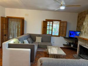A television and/or entertainment centre at Villa La Solana Rocabella