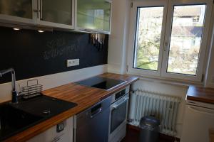a kitchen with a sink and a counter top at Ferienwohnung Aribo in Seeon-Seebruck