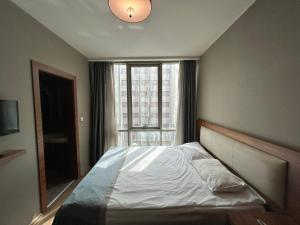 A bed or beds in a room at Reikartz 2017