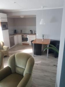 a kitchen with a chair and a table in a room at City Ferienhaus in Neheim in Arnsberg