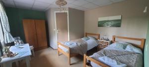 Postel nebo postele na pokoji v ubytování Abbaye de Belval