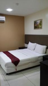 Postel nebo postele na pokoji v ubytování SohoTown Hotel