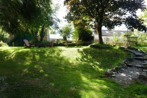 a park with a bench and a table in the grass at Ballyroe Accommodation in Leap