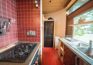 a kitchen with a stove top and a sink at OvalMountainLodge - Vacation STAY 34543v in Hakuba