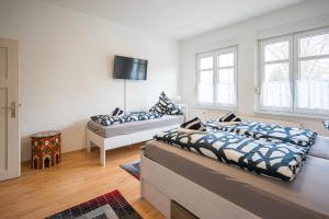 En eller flere senge i et værelse på Appartement am Westerntor II