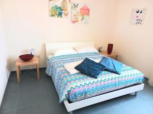 Postel nebo postele na pokoji v ubytování Una Chicca d'azzurro