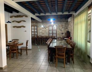 a dining room with a table and chairs in it at Casa Rural la Vertedera 2 in Villar de Ciervo