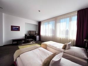 Postel nebo postele na pokoji v ubytování Hotel Turiec