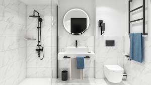 uma casa de banho branca com um lavatório e um espelho em Bô Hôtels Ambronay em Ambronay