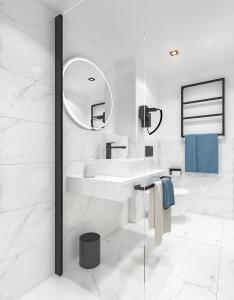 ein weißes Badezimmer mit einem Waschbecken und einem Spiegel in der Unterkunft Bô Hôtels Ambronay in Ambronay