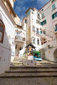 a group of buildings with stairs in front of them at The House of Flowers in Vietri