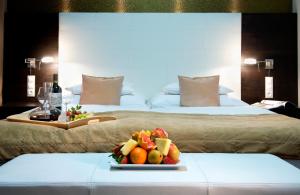 A bed or beds in a room at Hotel Turiec