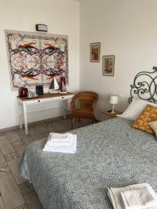 Llit o llits en una habitació de Villa Luisa B&B