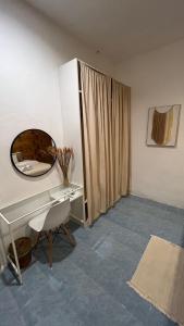 a room with a dressing table and a mirror at Alissia House in Ko Tao