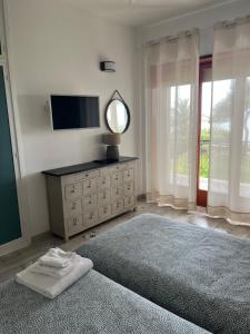 Llit o llits en una habitació de Villa Luisa B&B