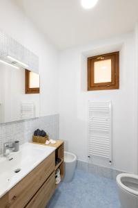 a bathroom with a sink and a toilet at [HEART OF TUSCANY] PINOCCHIO’S in Collodi +9 photos