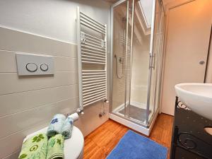 a bathroom with a toilet and a sink and a shower at Loft&Sun in La Spezia