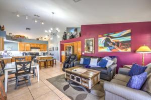 a living room with a couch and a table at Family Fun for Everyone in Las Vegas- 4 Bedrooms, Billiards, Game Room in Las Vegas
