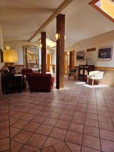 a living room with a large tiled floor at Hotel Telecabina in Sierra Nevada