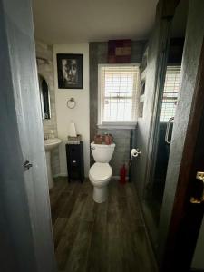 a bathroom with a toilet and a sink at Zen Life Oasis in Atlanta