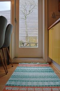 a rug on the floor in front of a window at Ragna's apartment downtown. in Reykjavík