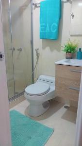 a bathroom with a shower and a toilet and a sink at Apart. con aire, frente al mar in Porlamar