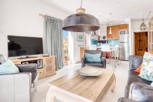 TV a/nebo společenská místnost v ubytování Casa amarilla del mar piso 3y4