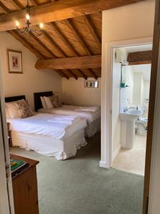 A bed or beds in a room at The Farm Burscough