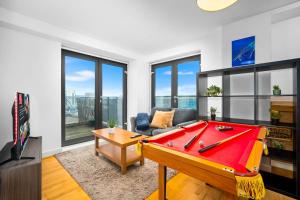 a living room with a pool table and a tv at Central Flat Pool Table Balcony in Sheffield