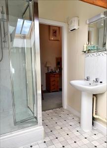 a bathroom with a shower and a sink at The Farm Burscough in Burscough