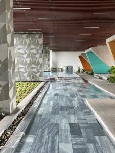 an image of a lobby with a tile floor at Khu Nghĩ Dưỡng Emerald Golf View in Thuan An