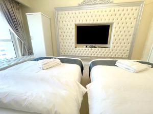 Postel nebo postele na pokoji v ubytování ROYAL BEACH RESIDENCES 2