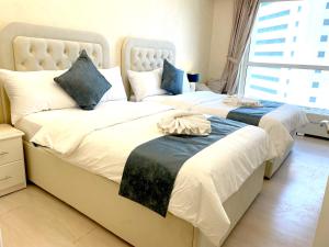 Postel nebo postele na pokoji v ubytování ROYAL BEACH RESIDENCES 2