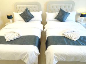 Postel nebo postele na pokoji v ubytování ROYAL BEACH RESIDENCES 2