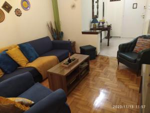a living room with a couch and a coffee table at Anna's Flat No2- 2 bedroom apartment in Volos