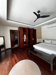a bedroom with a bed and a ceiling fan at The Residence Resort in Phuket +15 photos