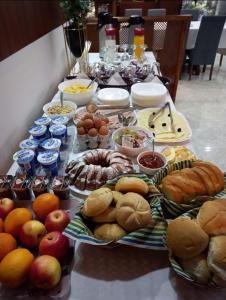 a table topped with lots of different types of food at Motel Liberta in Jajce