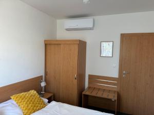 Postel nebo postele na pokoji v ubytování Apartmány KiRi
