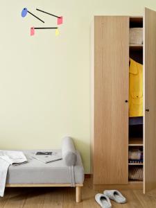 a bedroom with a bed and a book shelf at BRIK Apartment Hotel in Copenhagen